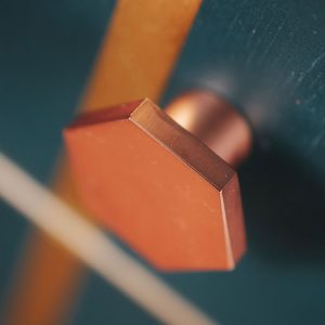 Petrol blue Art Deco cocktail cabinet with copper knobs and geometrics